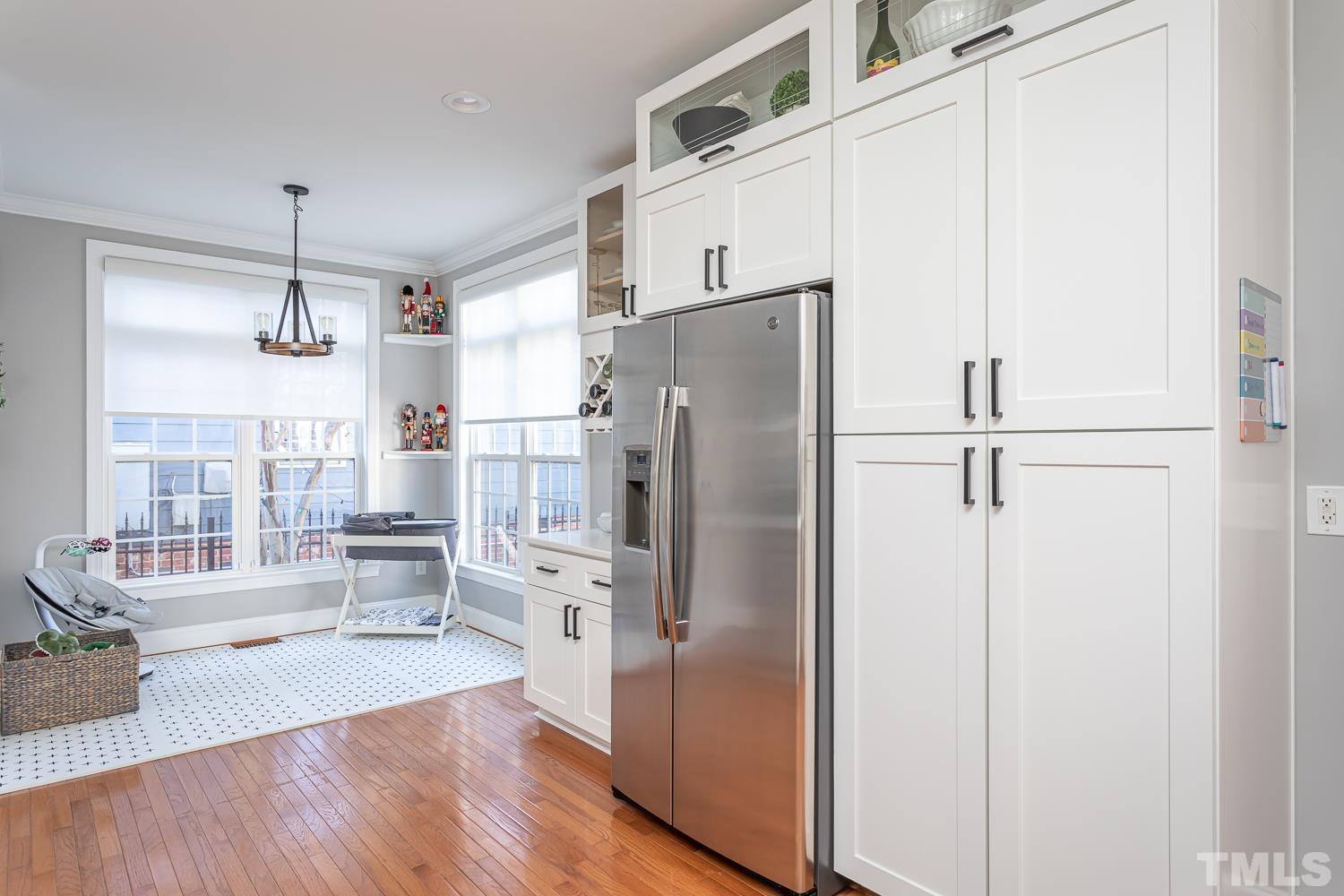 1233 North Blount Street Raleigh, NC 27604 - Photo 13 of 42 a kitchen with stainless steel appliances a refrigerator and a stove top oven