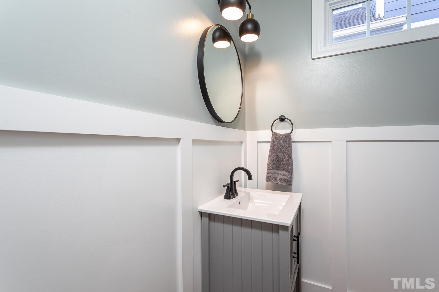1233 North Blount Street Raleigh, NC 27604 - Photo 17 of 42 a bathroom with a sink and a mirror