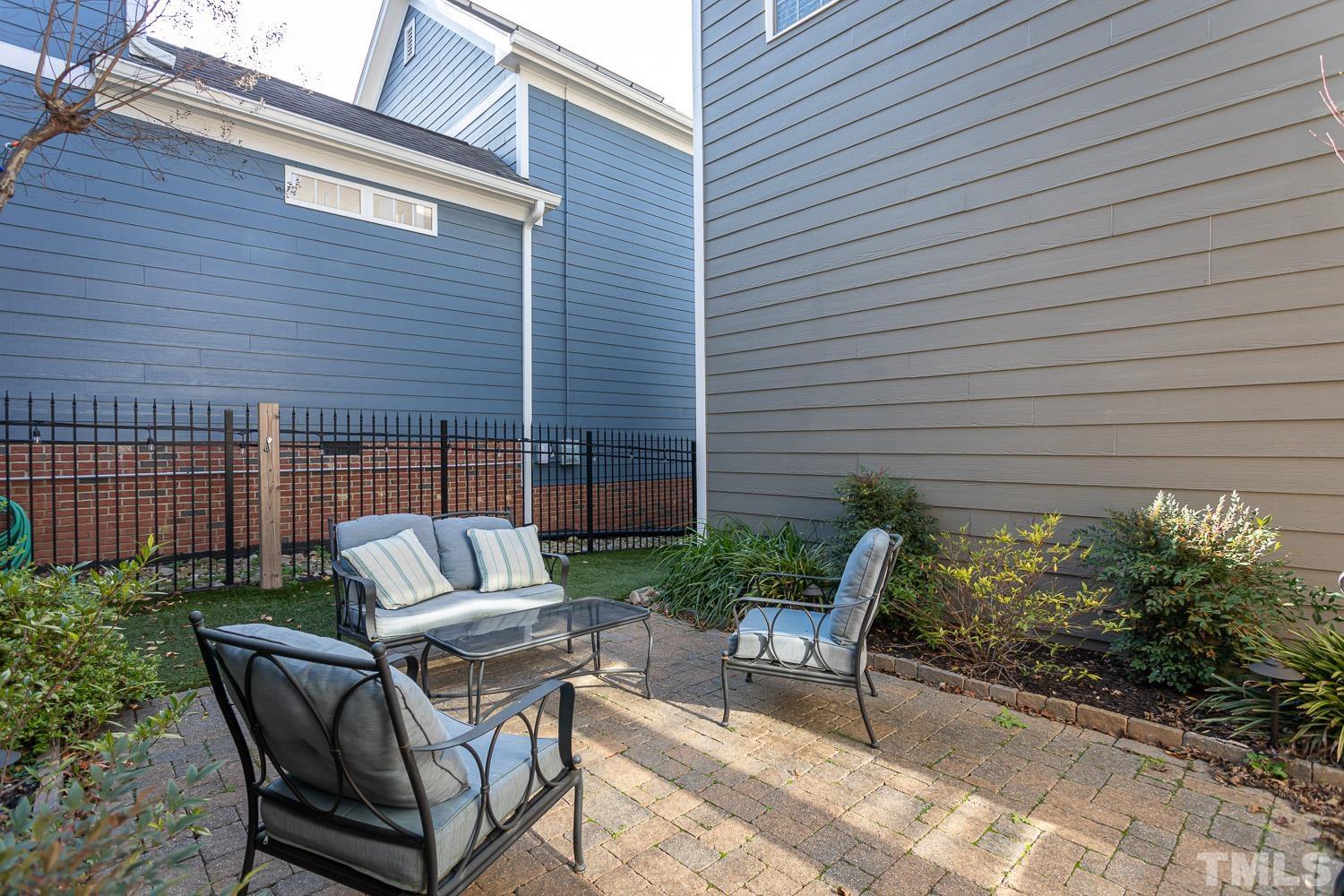 1233 North Blount Street Raleigh, NC 27604 - Photo 20 of 42 a view of backyard with outdoor seating and plants