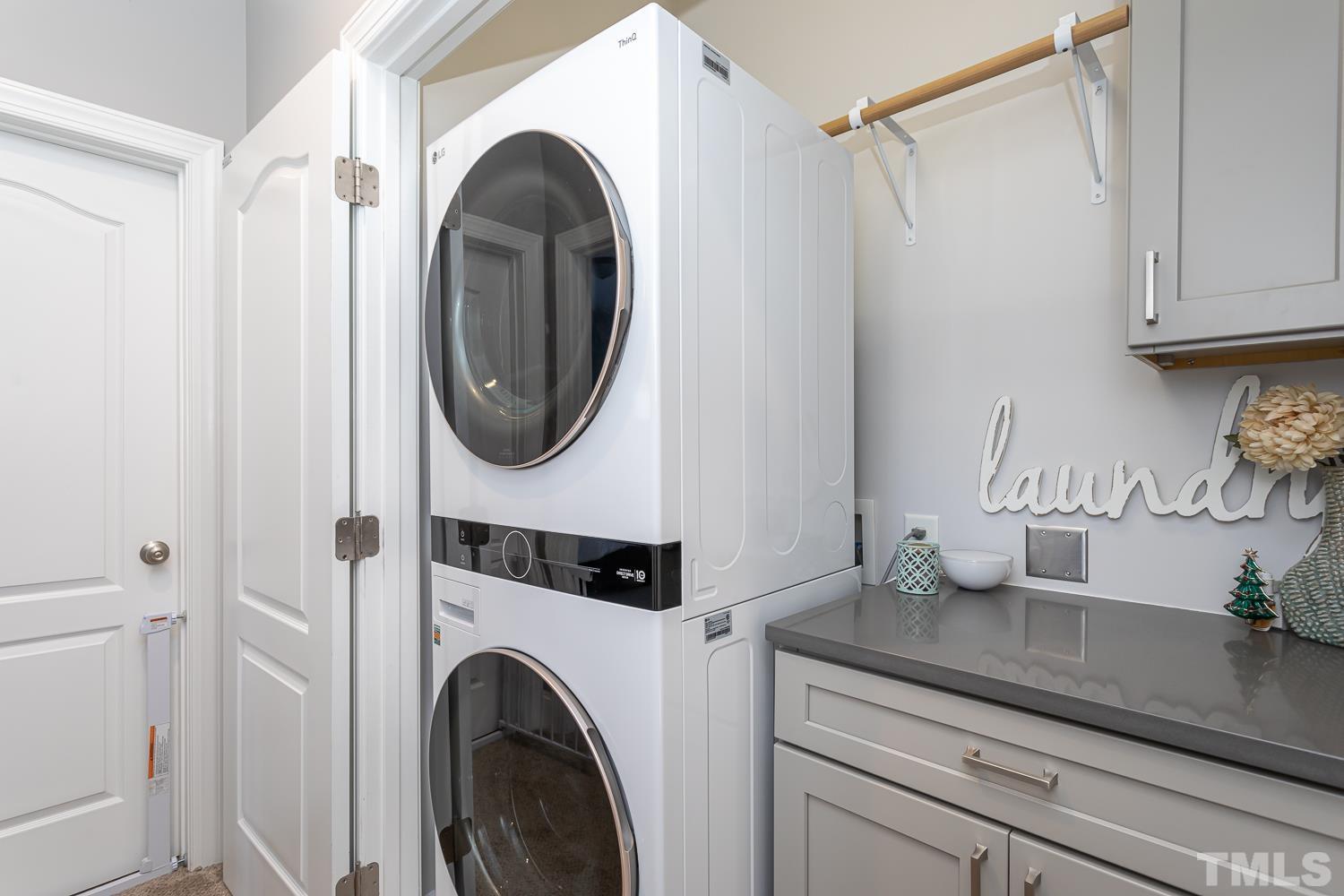 1233 North Blount Street Raleigh, NC 27604 - Photo 27 of 42 a close view of a utility room with dryer and washer