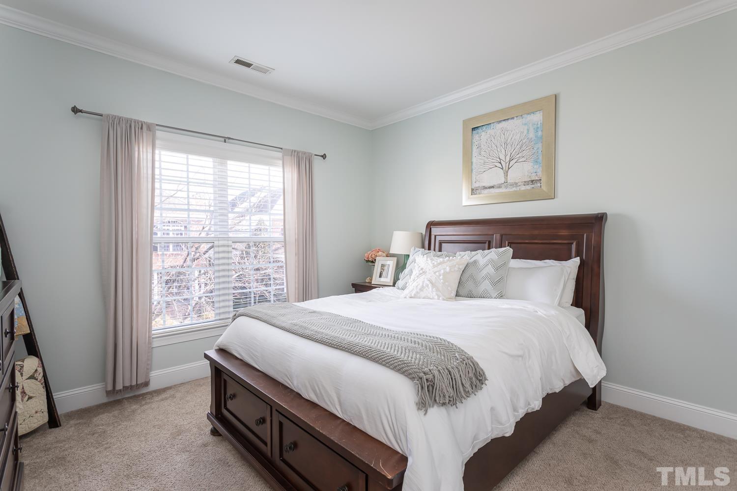 1233 North Blount Street Raleigh, NC 27604 - Photo 28 of 42 a bedroom with a bed and a window