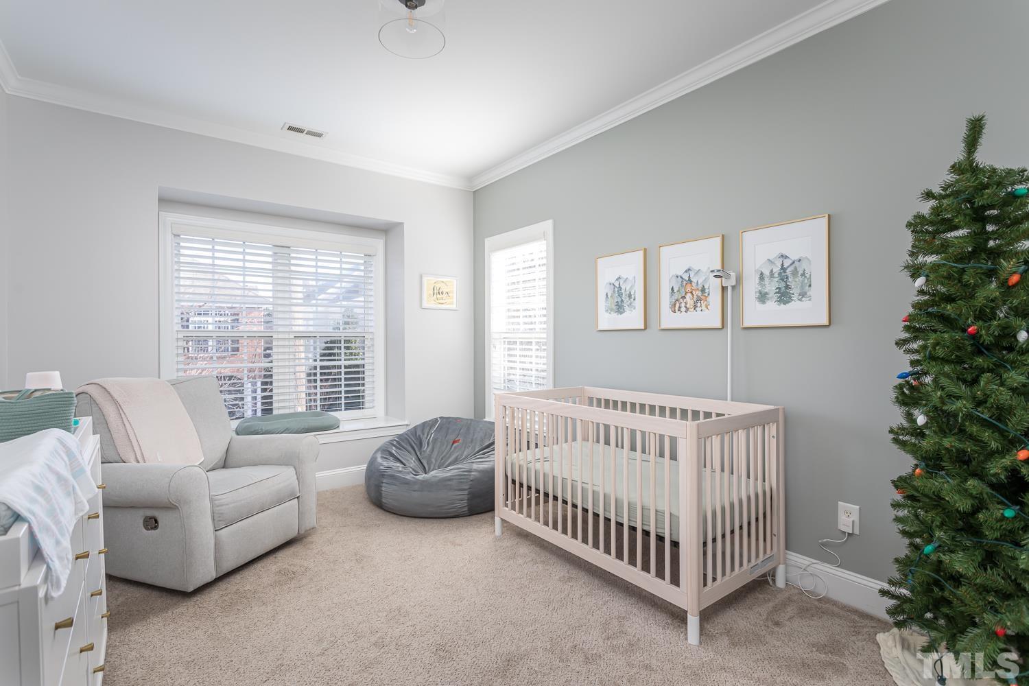 1233 North Blount Street Raleigh, NC 27604 - Photo 29 of 42 a bedroom with furniture and a potted plant
