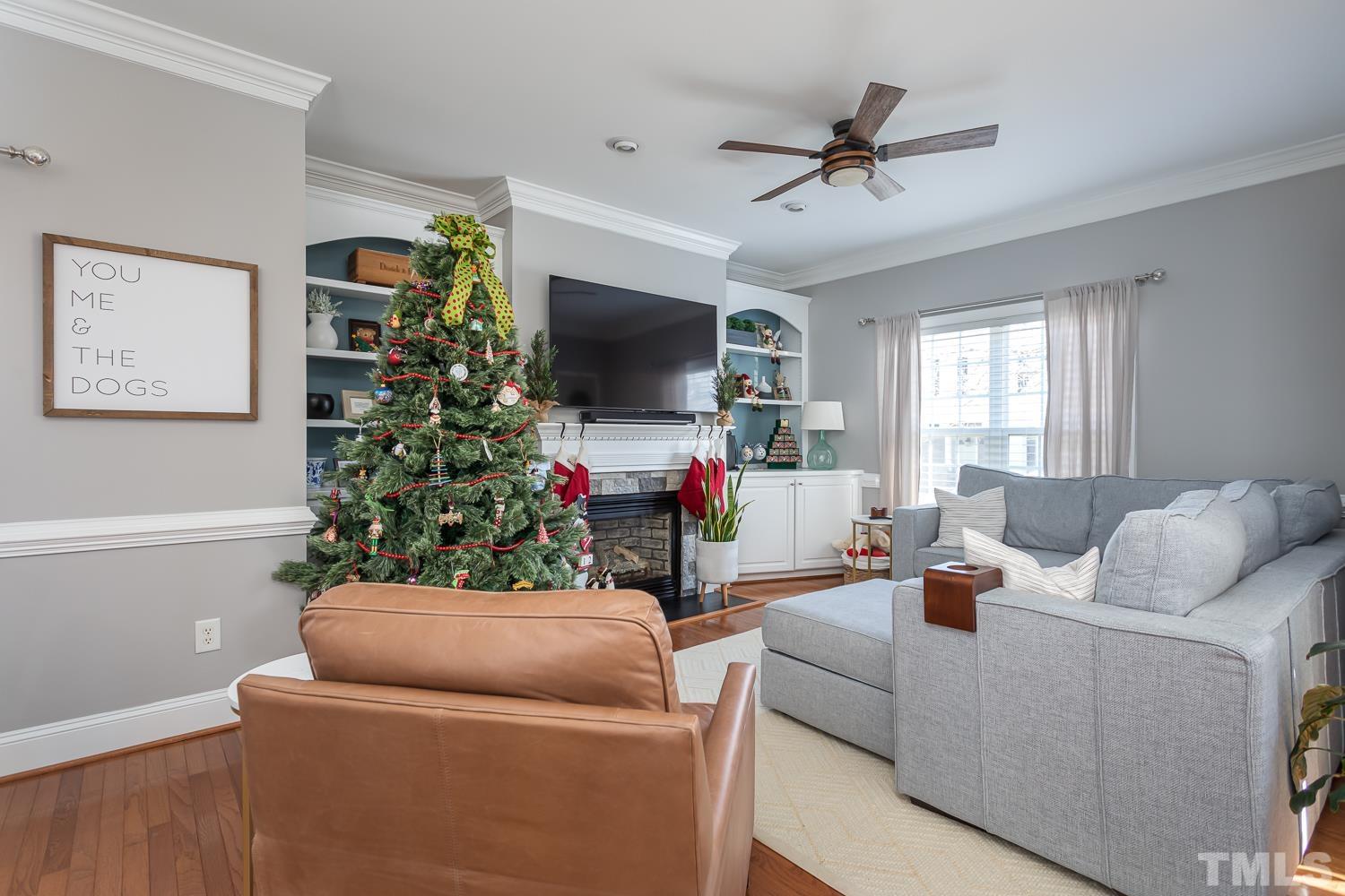 1233 North Blount Street Raleigh, NC 27604 - Photo 3 of 42 a living room with furniture and a flat screen tv