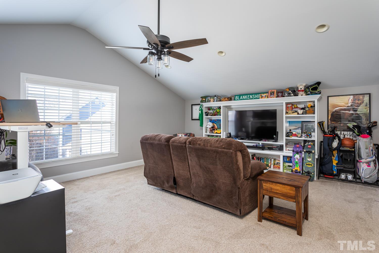 1233 North Blount Street Raleigh, NC 27604 - Photo 32 of 42 a living room with furniture and a flat screen tv