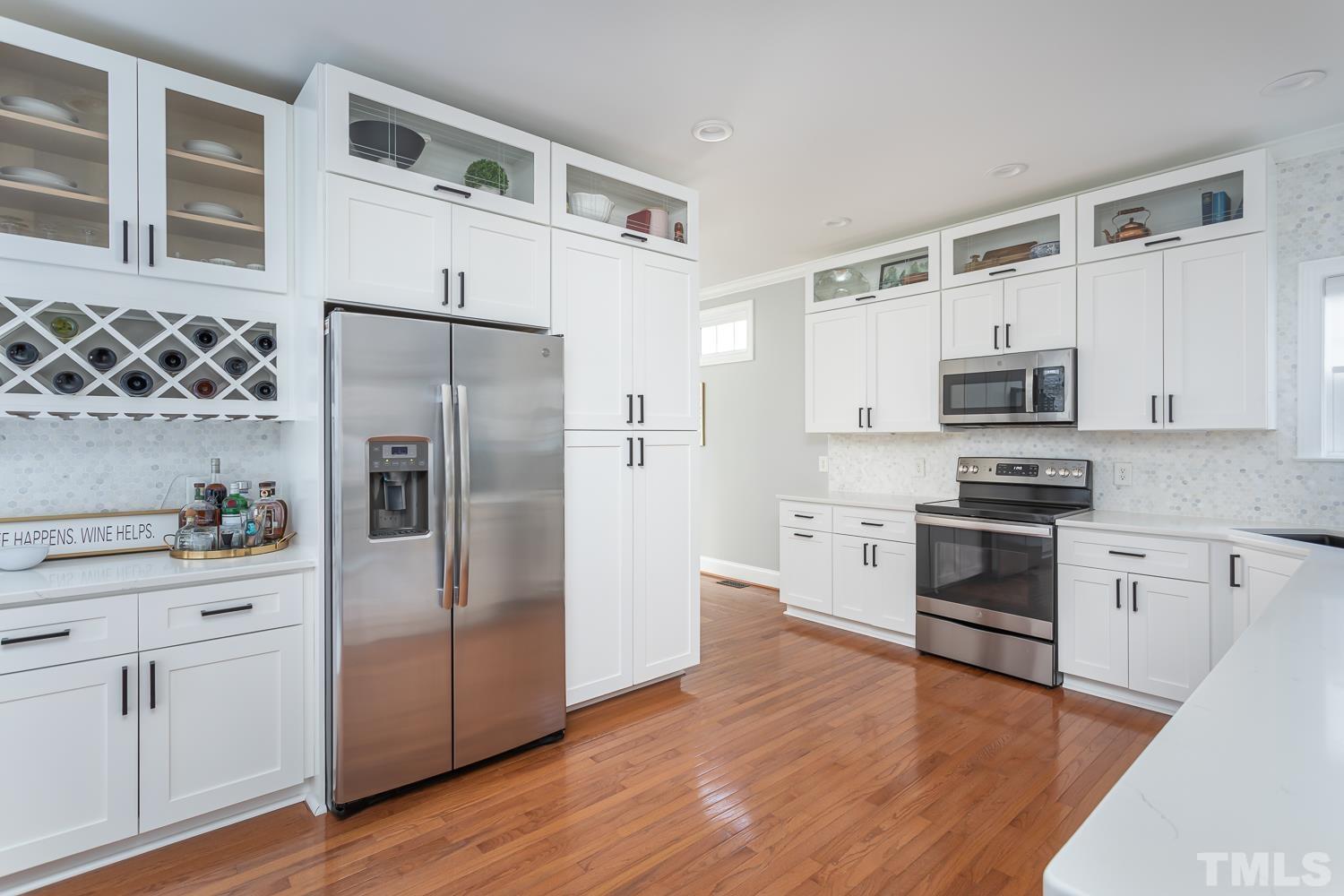 1233 North Blount Street Raleigh, NC 27604 - Photo 9 of 42 a kitchen with stainless steel appliances a refrigerator stove and microwave