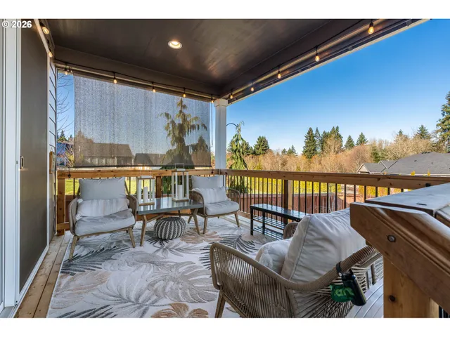 a view of a chairs and table in patio