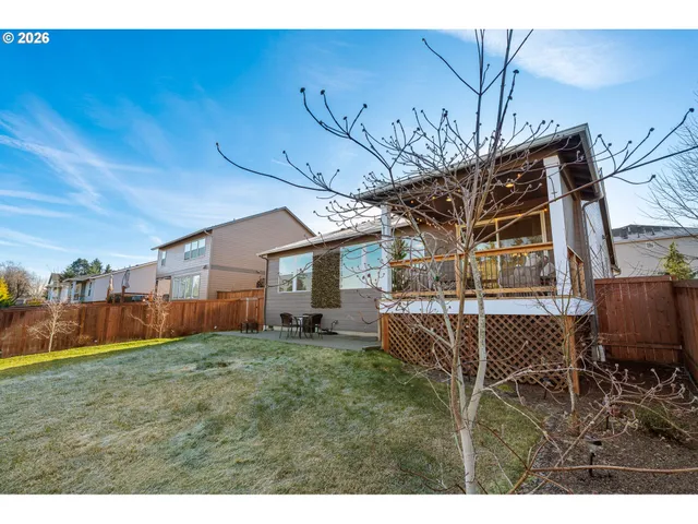 a view of a backyard with sitting area