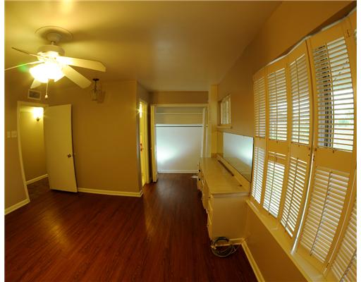 409 Barracuda Place Corpus Christi, TX 78411 - Photo 7 of 10 a view of empty room with wooden floor