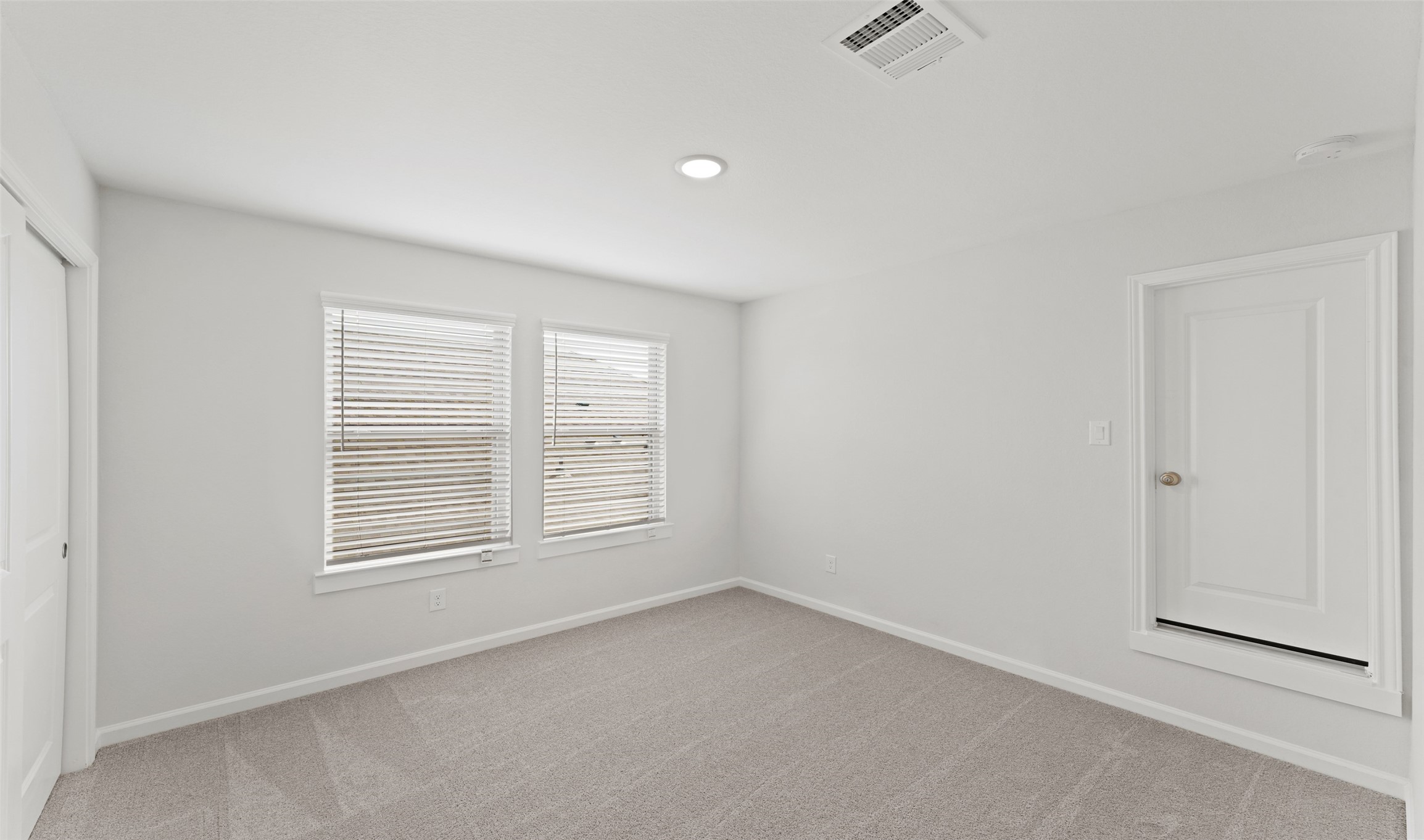 29306 Suncreek Rnch Court Waller, TX 77484 - Photo 11 of 27 an empty room with windows