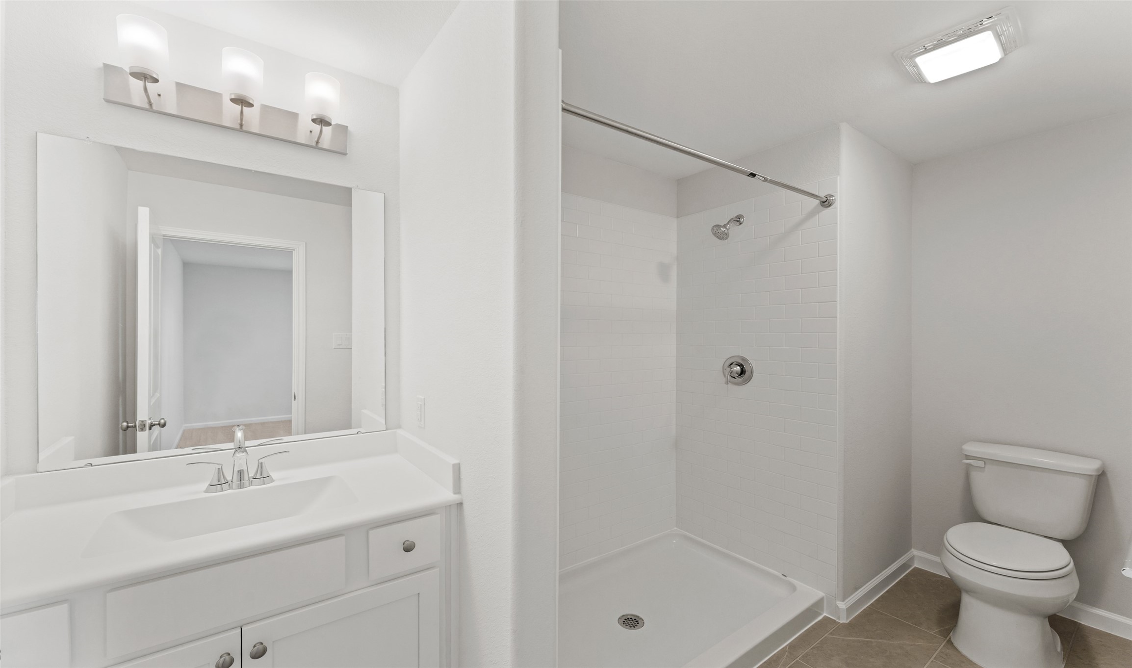 29306 Suncreek Rnch Court Waller, TX 77484 - Photo 15 of 27 a bathroom with a shower sink vanity mirror and toilet