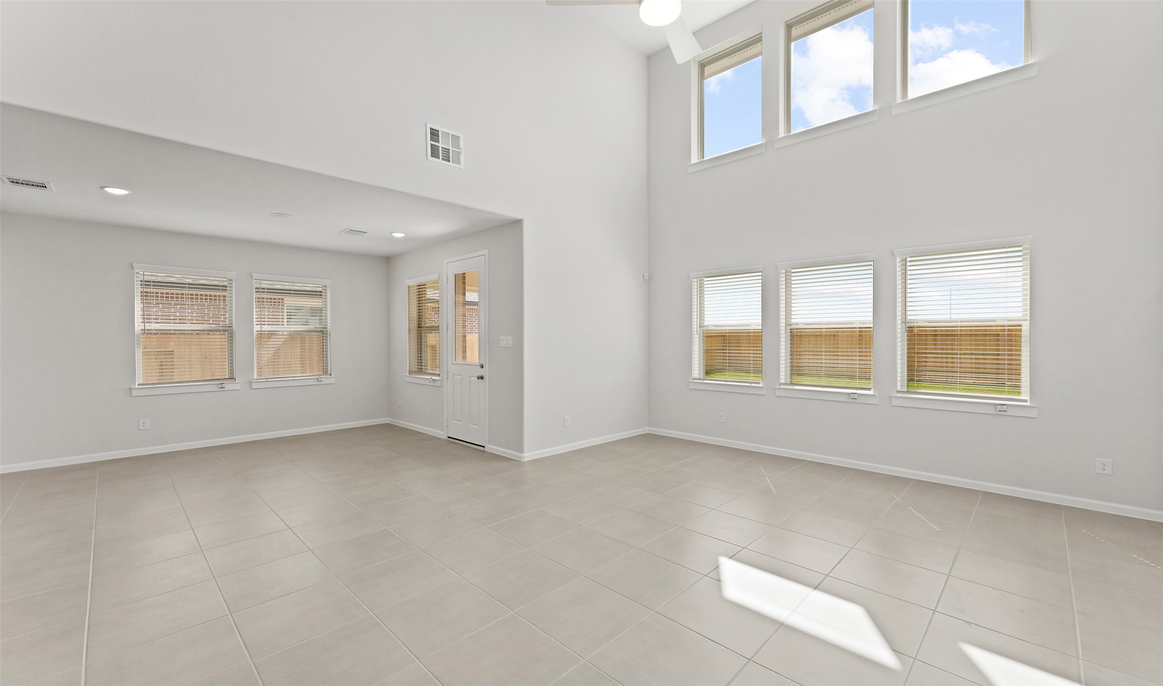 29306 Suncreek Rnch Court Waller, TX 77484 - Photo 4 of 27 a view of an empty room with a window