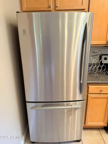 a white refrigerator freezer sitting in a kitchen