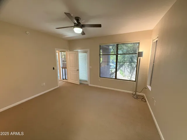 a view of an empty room with a window