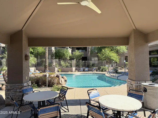 a view of a dining room with furniture wooden floor and a potted plant