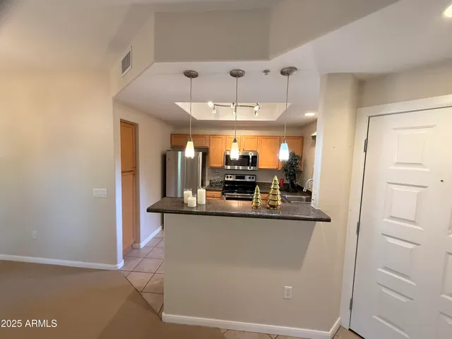 a view of a kitchen from the hallway