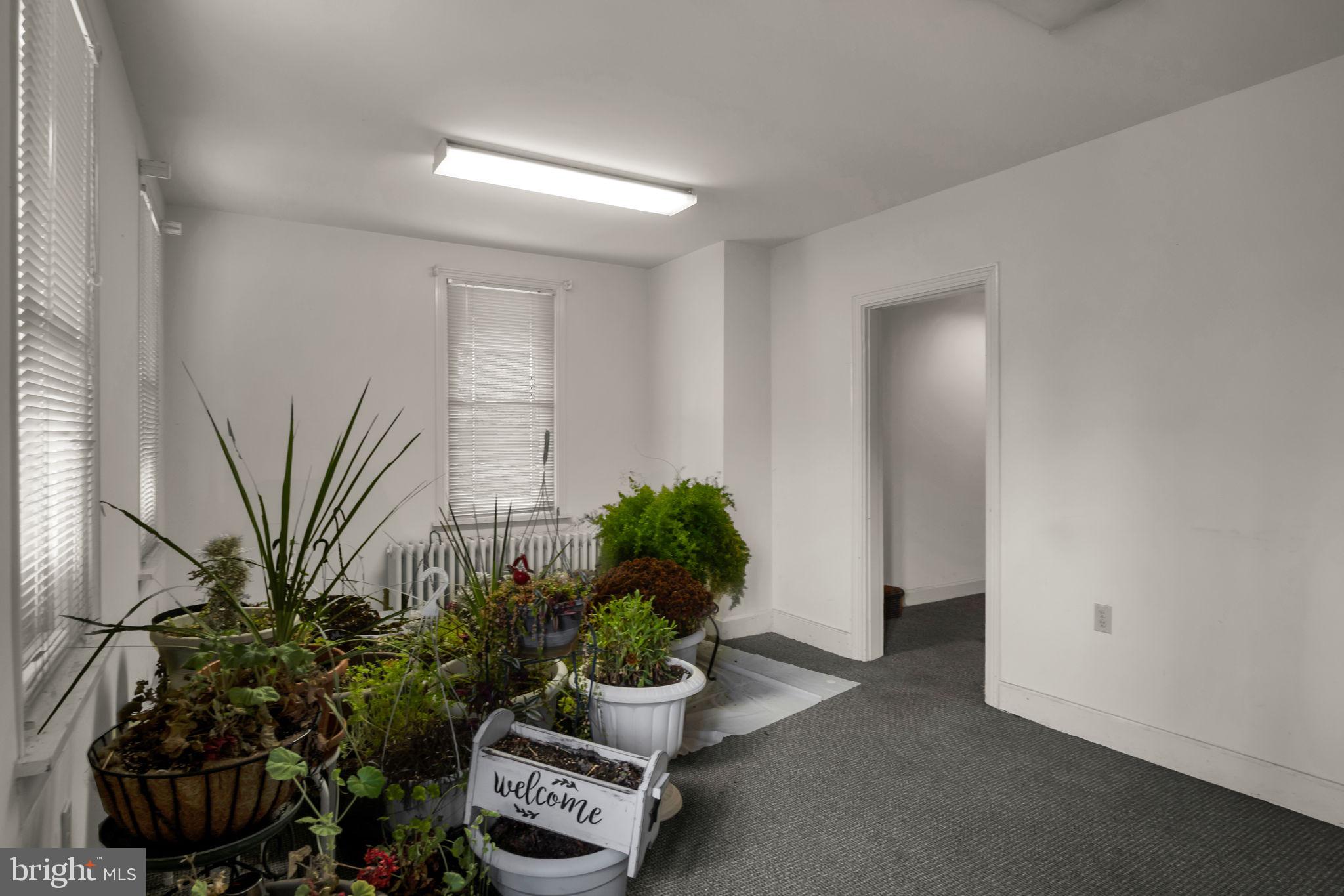 1602 Spring Road Carlisle, PA 17013 - Photo 22 of 33 a room with a potted plant and a window