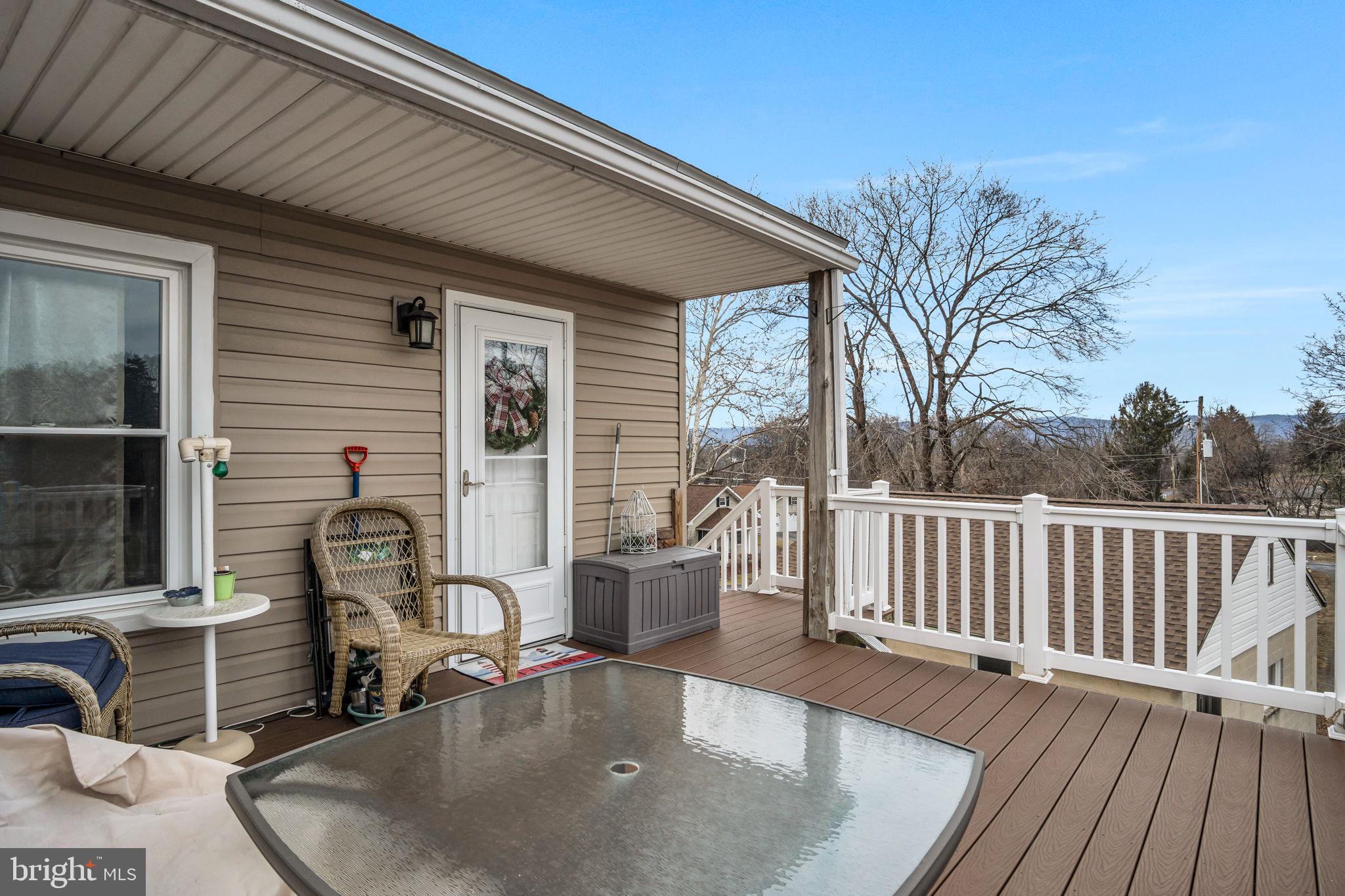 1602 Spring Road Carlisle, PA 17013 - Photo 5 of 33 a balcony with table and chairs