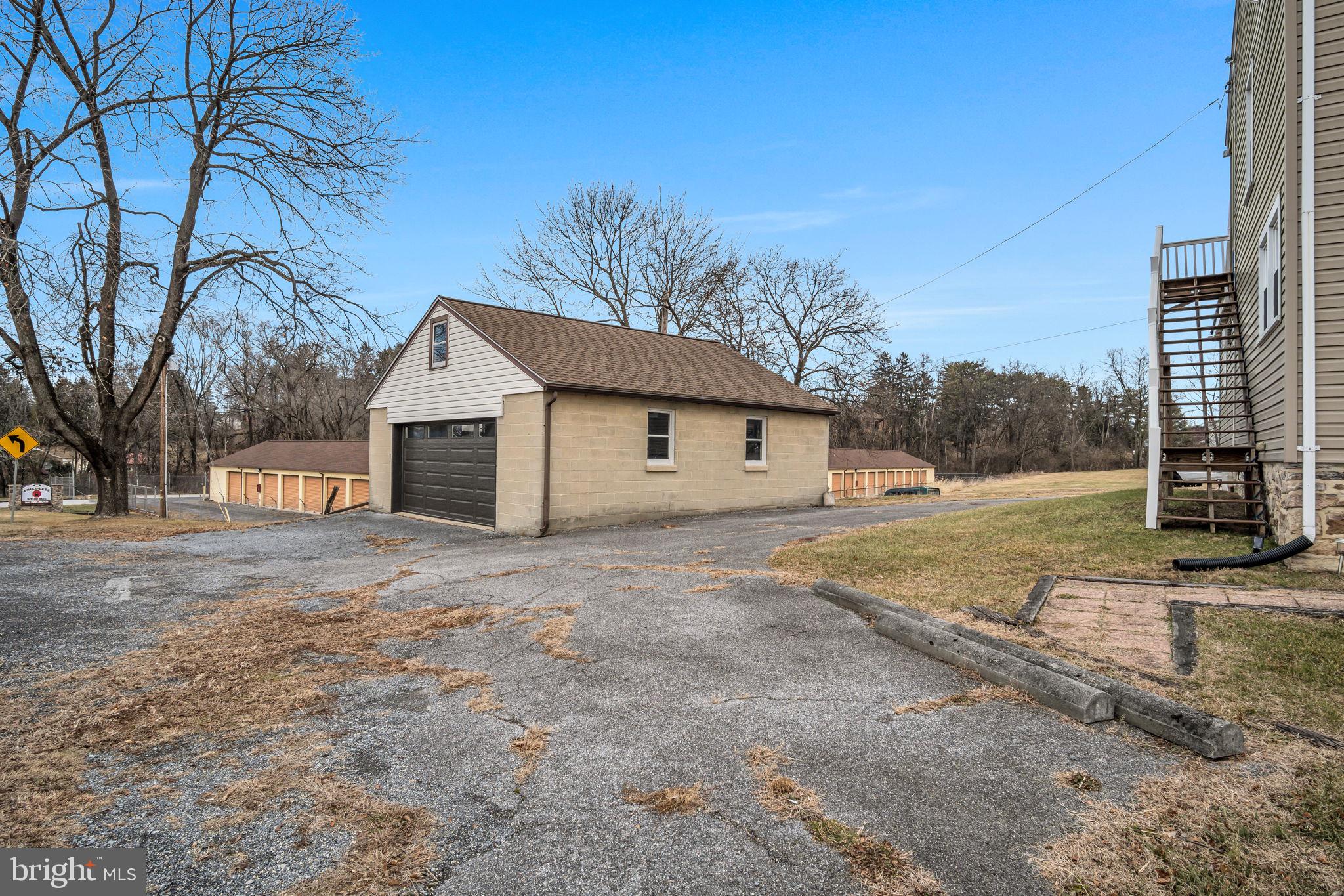 1602 Spring Road Carlisle, PA 17013 - Photo 7 of 33 a front view of a house with a yard and garage