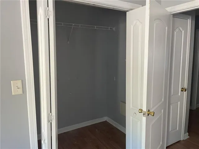 an empty room with wooden floor