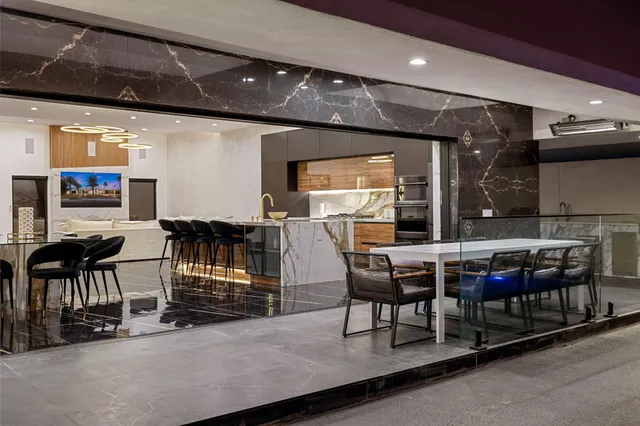 a bed room with a bed and glass door