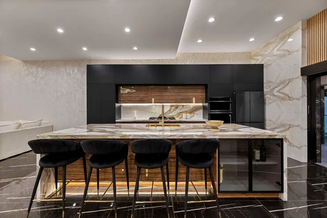 a kitchen with a table and chairs in it