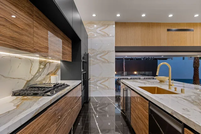 a kitchen with a table and chairs in it