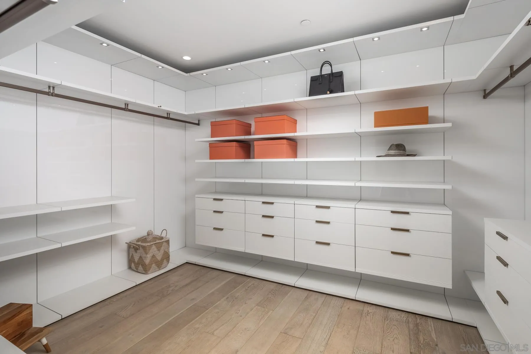303 Hillcrest Drive Encinitas, CA 92024 - Photo 17 of 28 a view of white cabinets with wooden floors