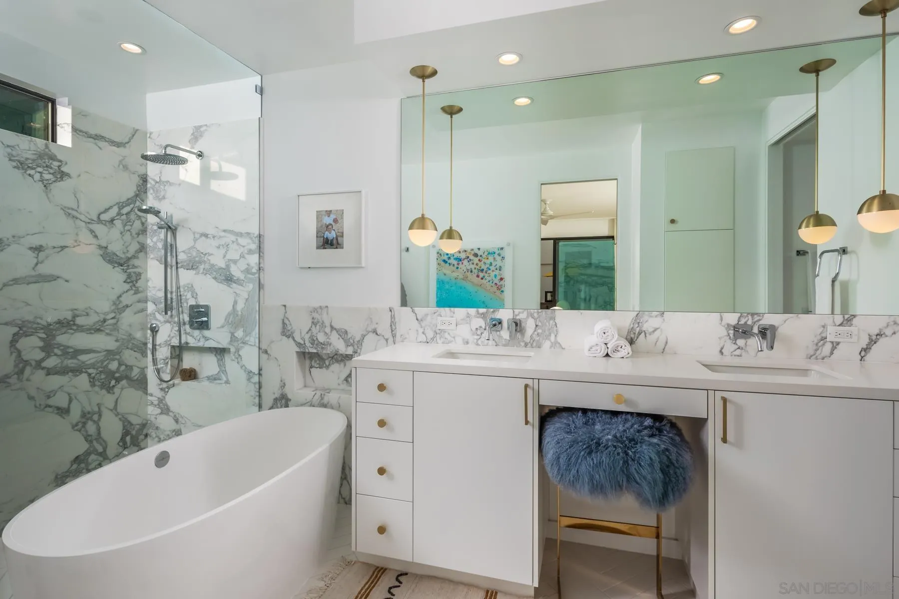 303 Hillcrest Drive Encinitas, CA 92024 - Photo 18 of 28 a bathroom with a bathtub double sink and a mirror