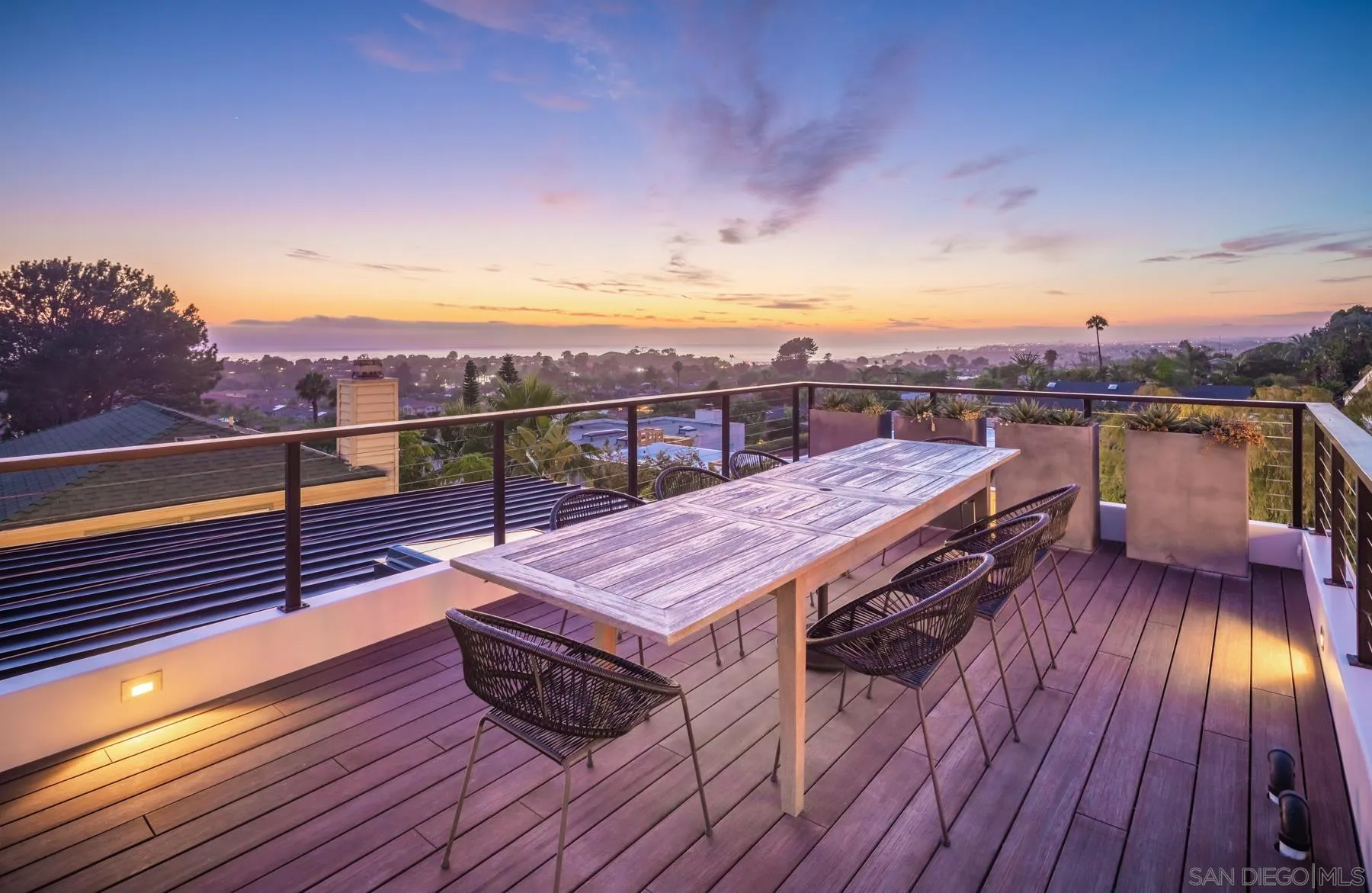 303 Hillcrest Drive Encinitas, CA 92024 - Photo 2 of 28 a view of a terrace with wooden floor and city view