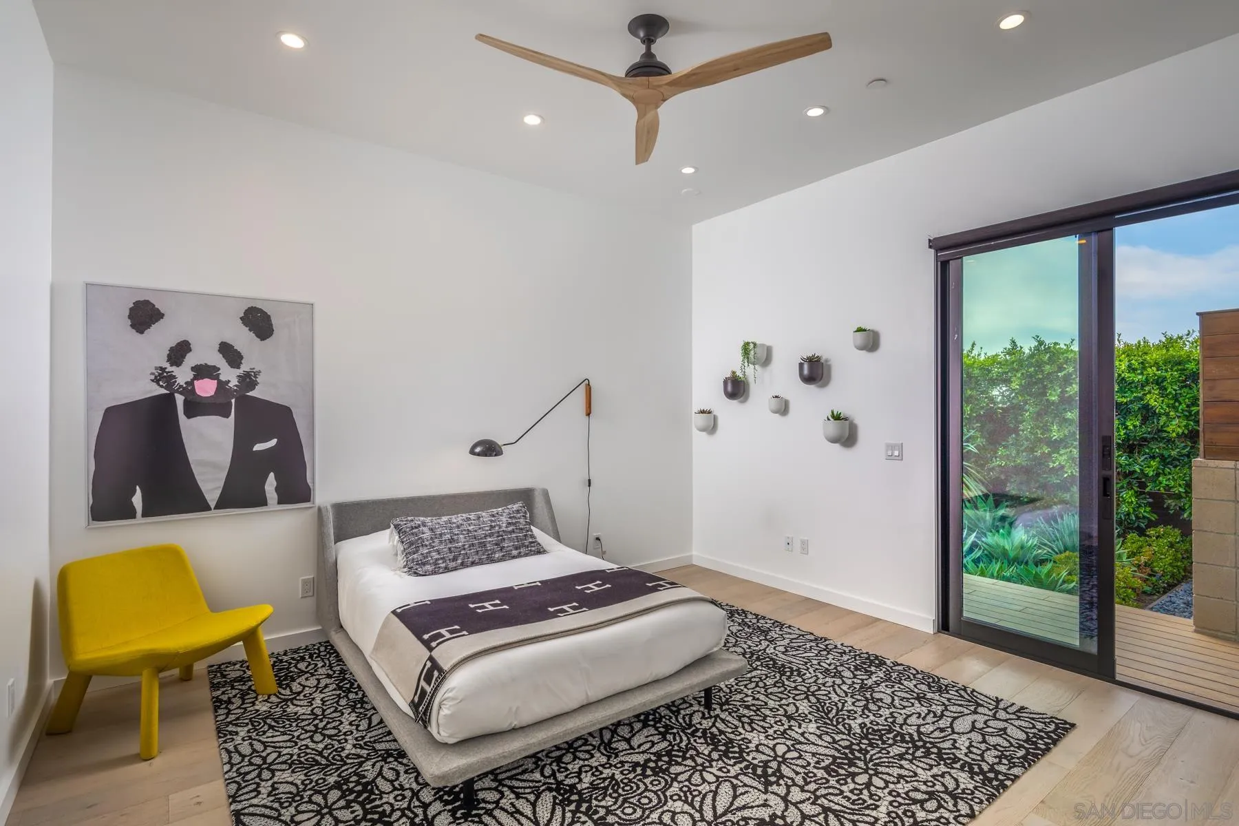 303 Hillcrest Drive Encinitas, CA 92024 - Photo 21 of 28 a bedroom with a bed and a window