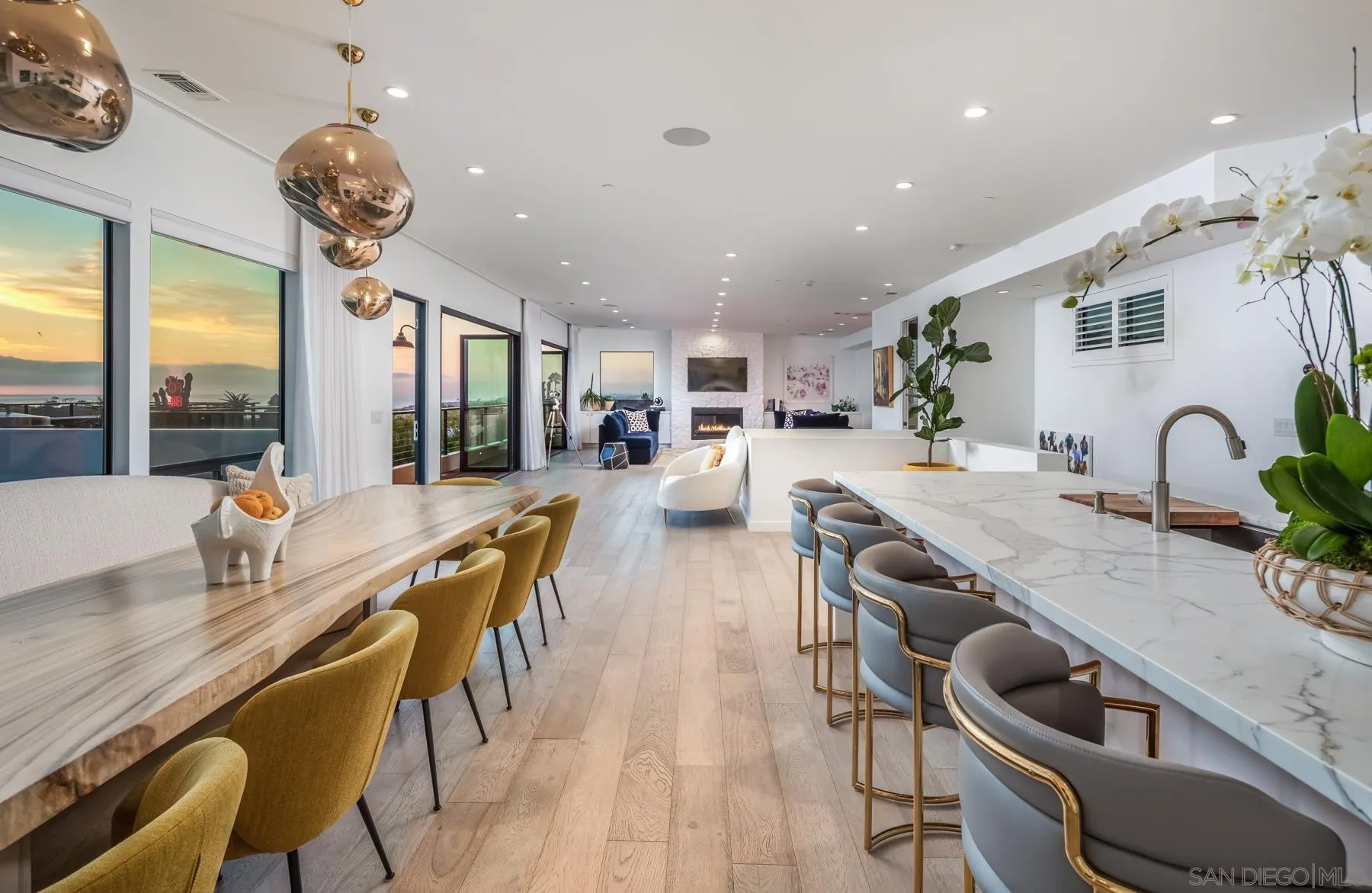 303 Hillcrest Drive Encinitas, CA 92024 - Photo 4 of 28 a kitchen with counter space dining table and chairs