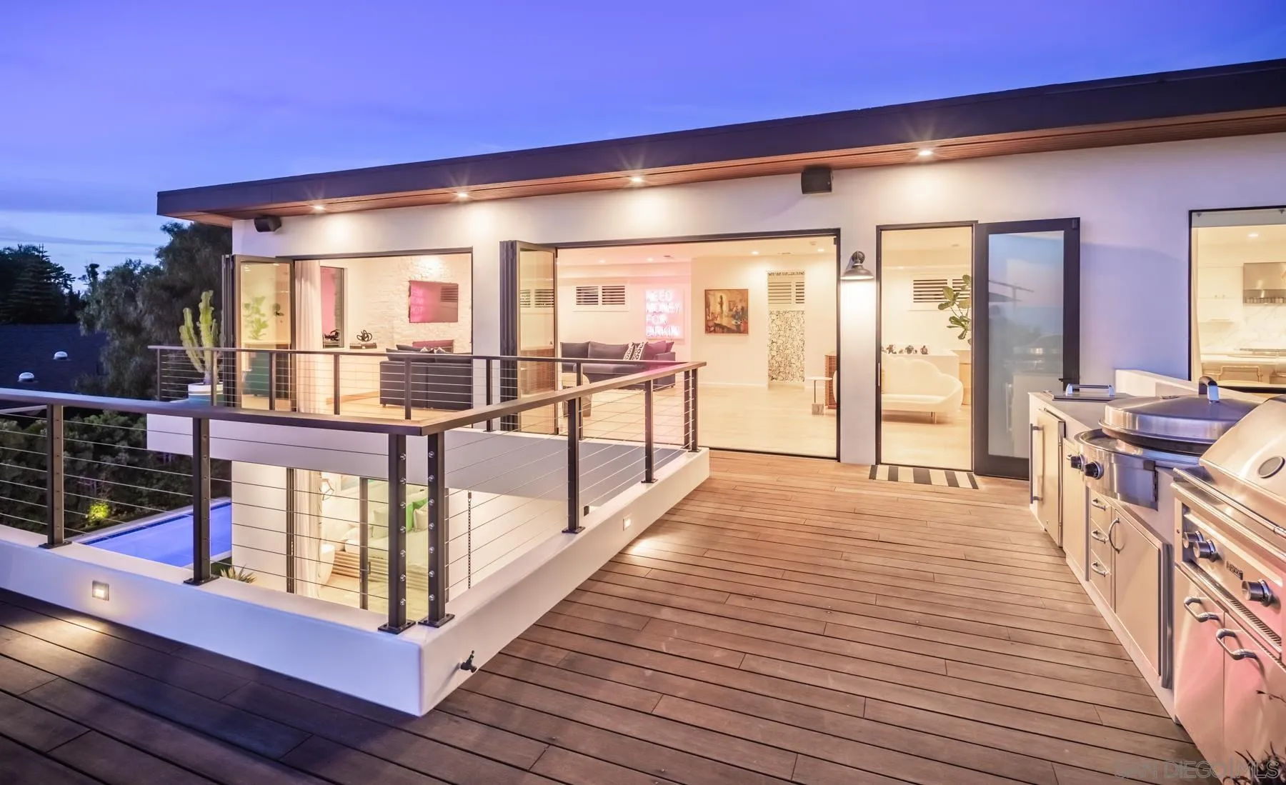 303 Hillcrest Drive Encinitas, CA 92024 - Photo 7 of 28 a view of a porch with wooden floor and furniture