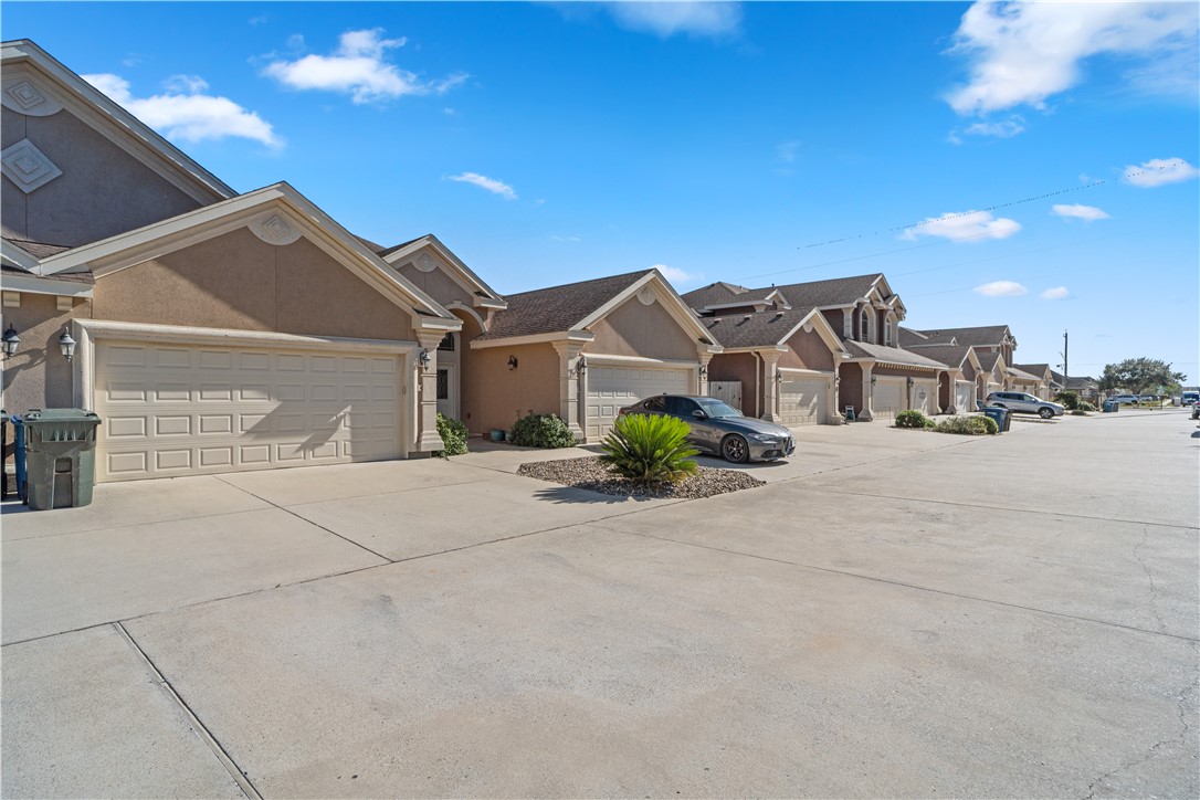 6934 Wooldridge Road, Unit K Corpus Christi, TX 78414 - Photo 2 of 20 a view of a house with a street