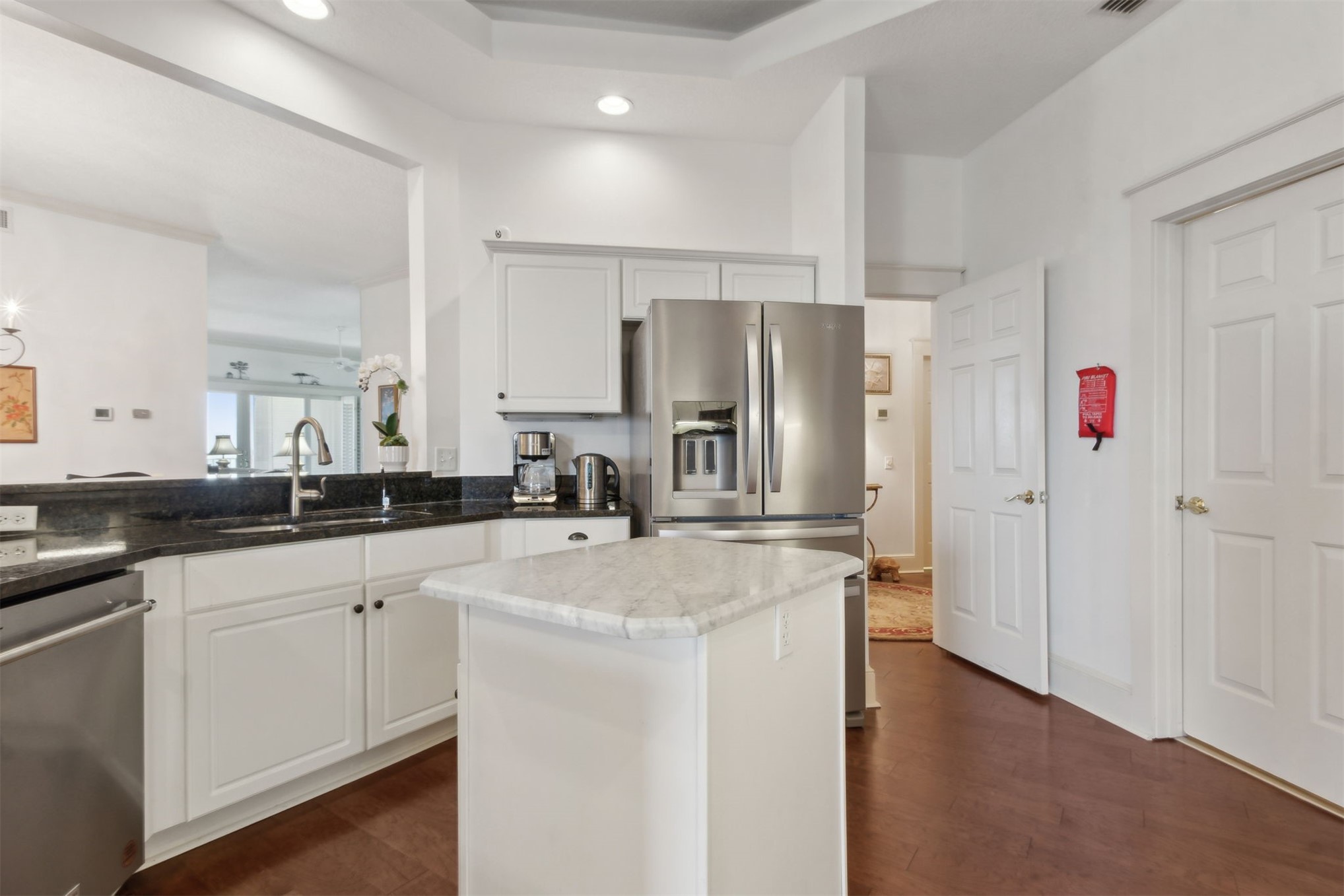 418 Beachside Place, Unit 418 Fernandina Beach, FL 32034 - Photo 17 of 91 a kitchen with refrigerator and cabinets