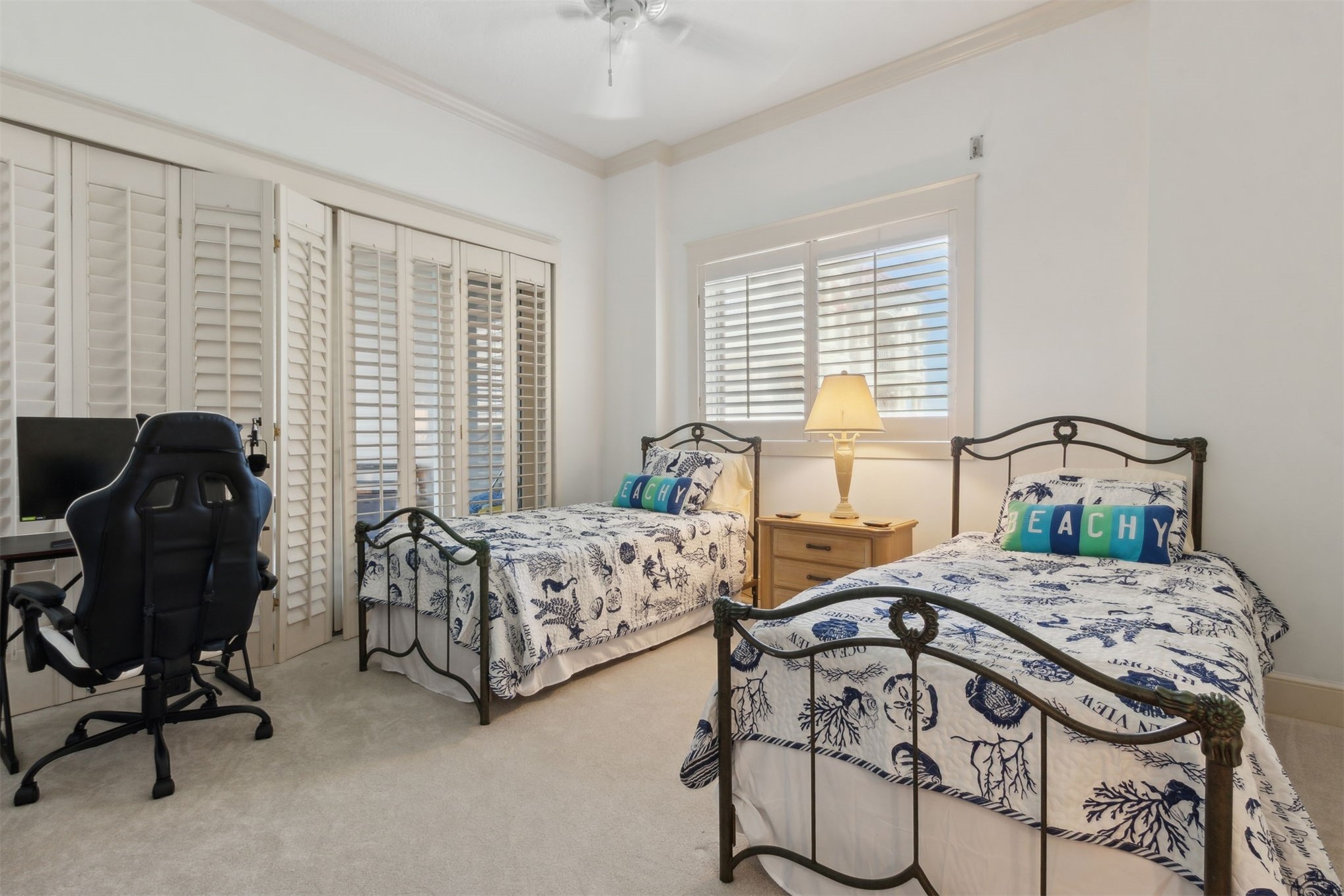 418 Beachside Place, Unit 418 Fernandina Beach, FL 32034 - Photo 35 of 91 a bedroom with a bed a table and chair