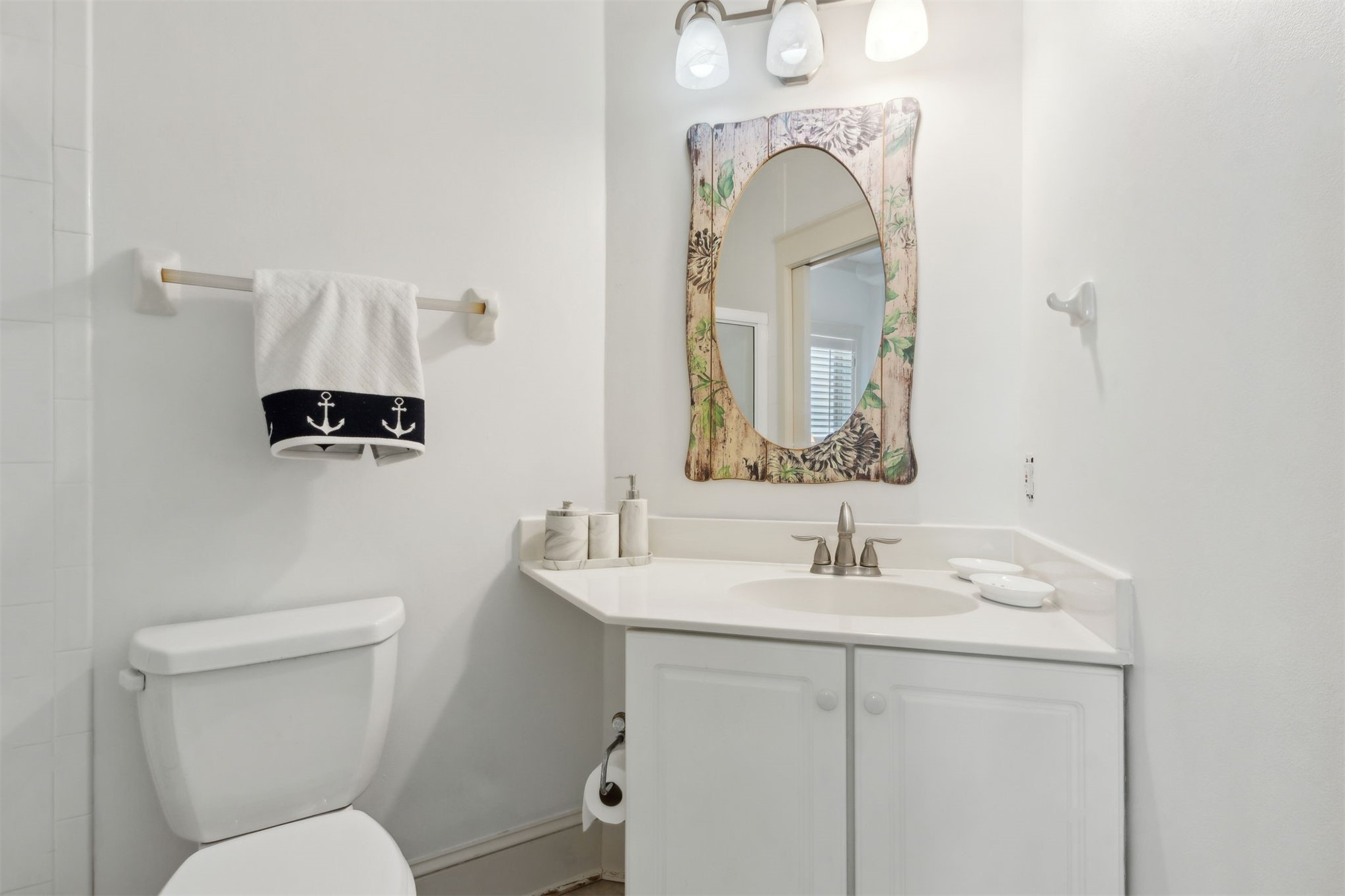 418 Beachside Place, Unit 418 Fernandina Beach, FL 32034 - Photo 37 of 91 a bathroom with a toilet sink and mirror