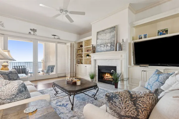a dining room with furniture and chandelier