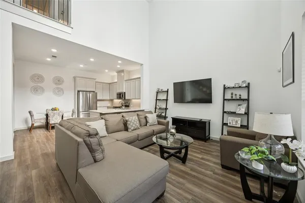 a living room with furniture flat screen tv and a fireplace