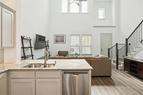 a kitchen with sink cabinets and window