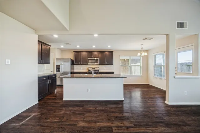 a view of kitchen with wooden floor