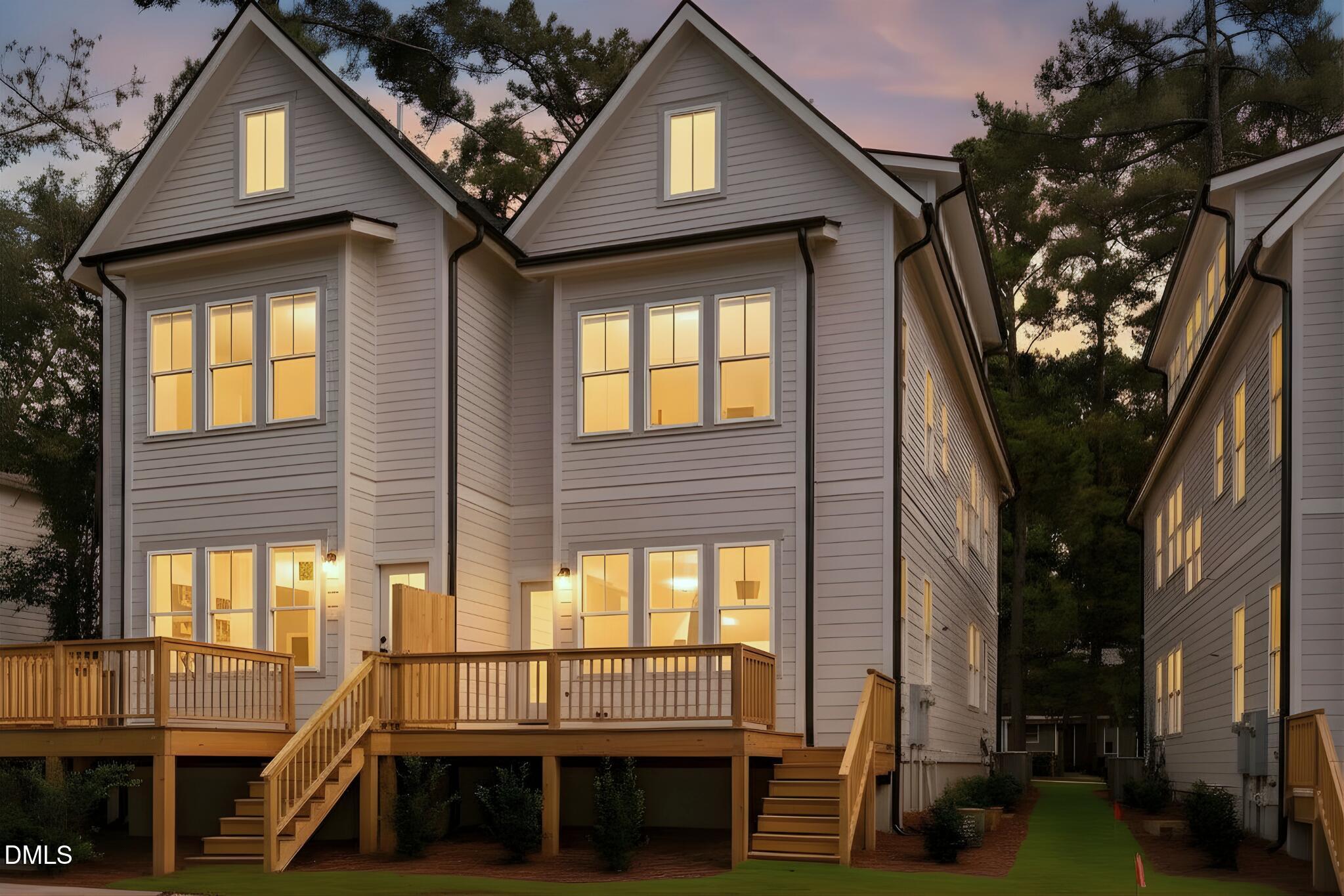 5061 Lundy Drive, Unit 101 Raleigh, NC 27606 - Photo 2 of 51 a view of a house with a large window and car parked