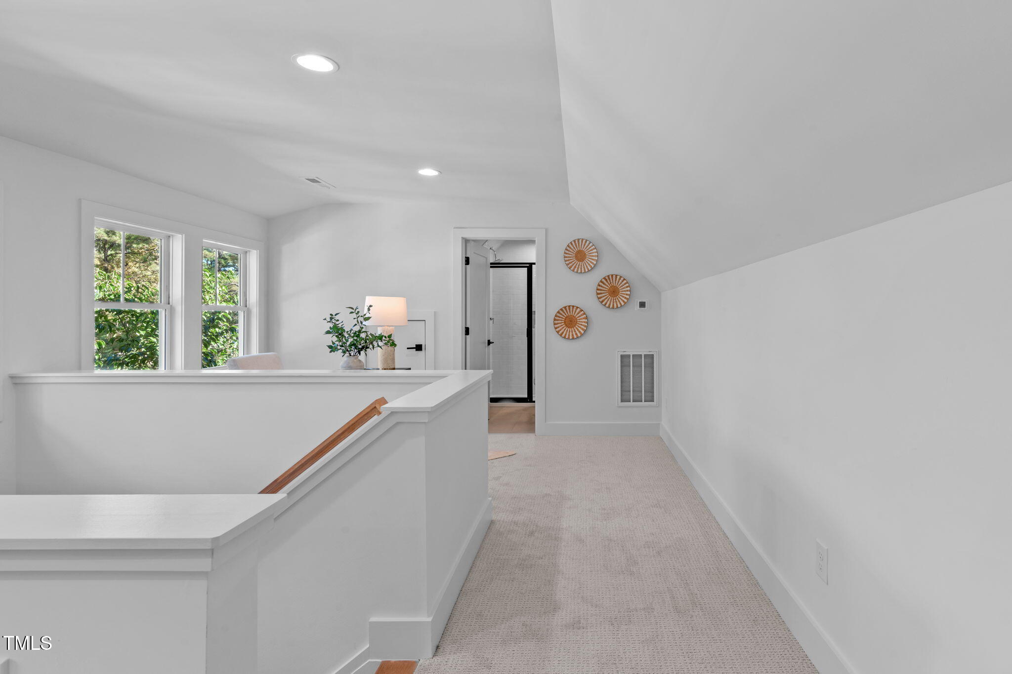 5061 Lundy Drive, Unit 101 Raleigh, NC 27606 - Photo 28 of 49 a view of a hallway with window and stairs