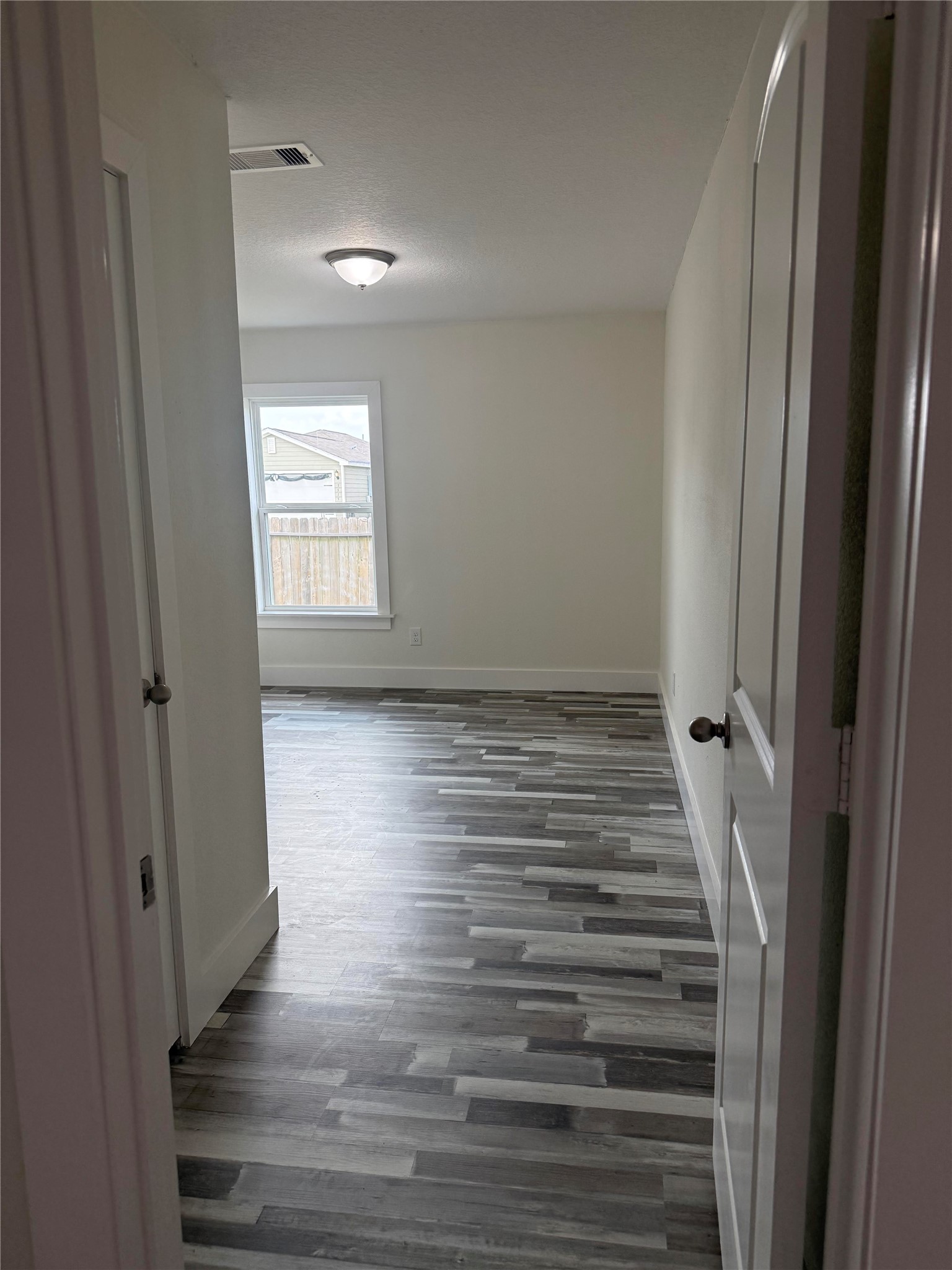 8419 Hannah Rd Cove Cove, TX 77523 - Photo 9 of 28 a view of room with window and wooden floor