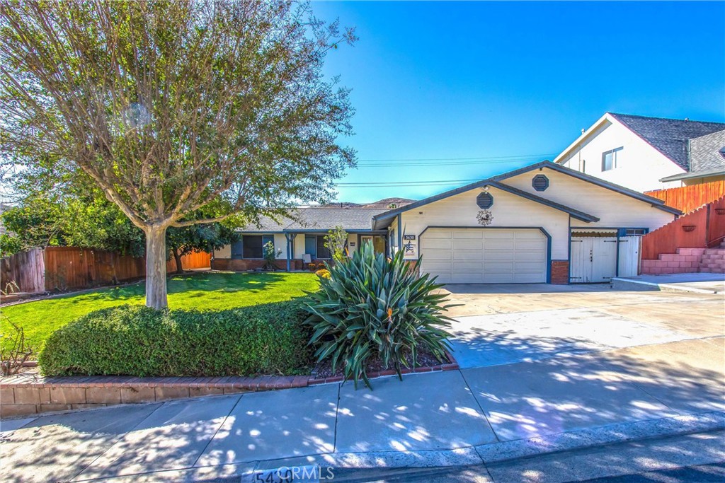 5430 Sierra Vista Avenue Riverside, CA 92505 - Photo 1 of 1 a front view of a house with a yard and garage