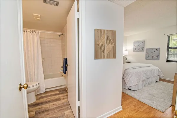 a en suite bathroom with a granite countertop sink