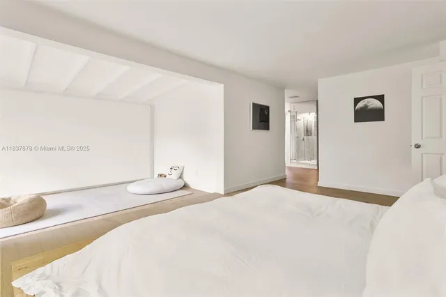 a bedroom with a bed and a cabinets