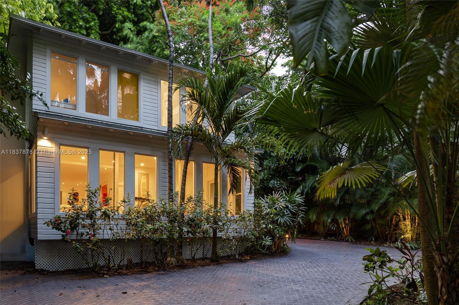 4286 Douglas Road Miami, FL 33133 - Photo 2 of 51 a couple of potted plants in front of house