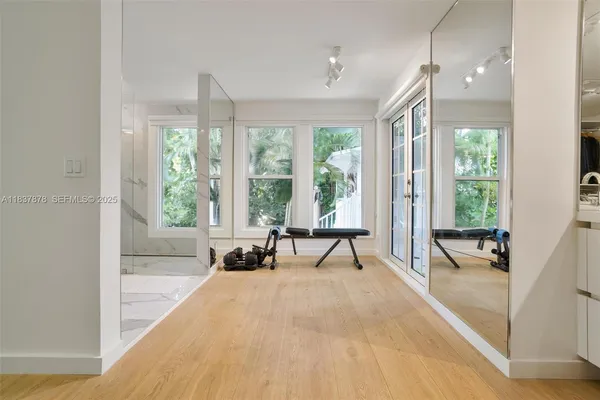 a spacious bathroom with a large window and a bath tub