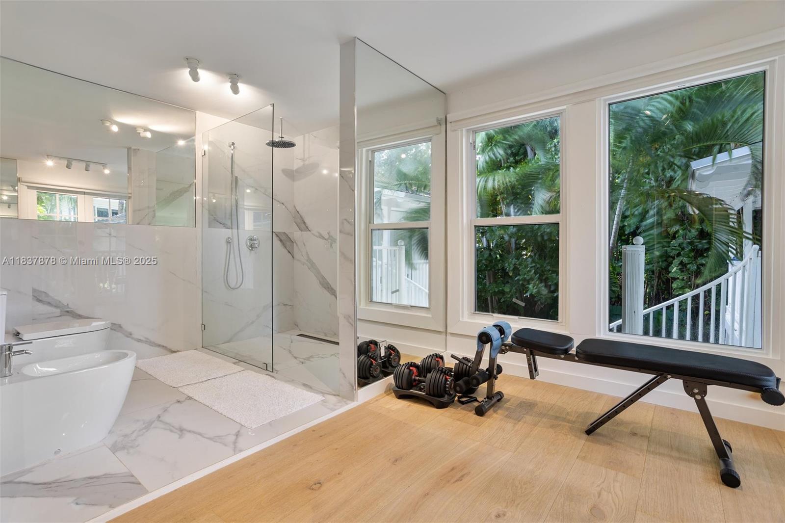 4286 Douglas Road Miami, FL 33133 - Photo 22 of 51 a bedroom with furniture and a large window