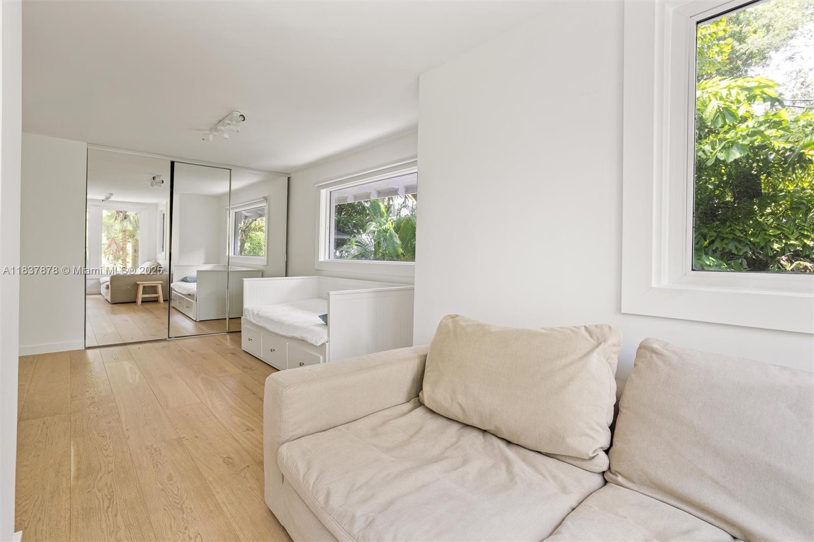 4286 Douglas Road Miami, FL 33133 - Photo 25 of 51 a living room with furniture and a large window